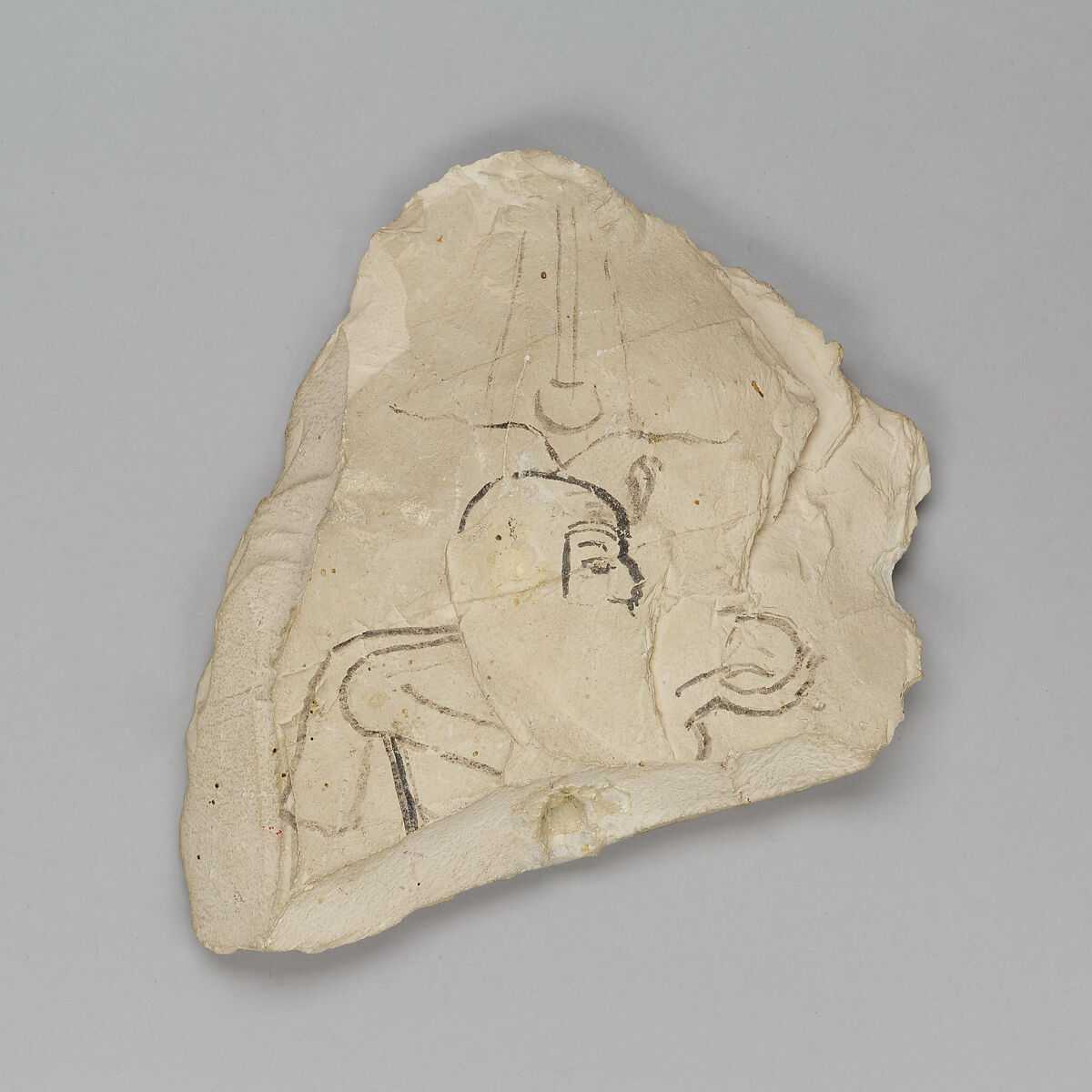 Ostracon depicting Ramesses IX offering Maat, attributed to the chief draftsman Amenhotep, Limestone, ink