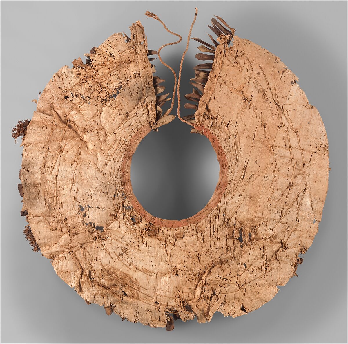 Floral collar from Tutankhamun's Embalming Cache, Papyrus, olive leaves, persea leaves, nightshade berries, celery (?), faience, linen dyed red