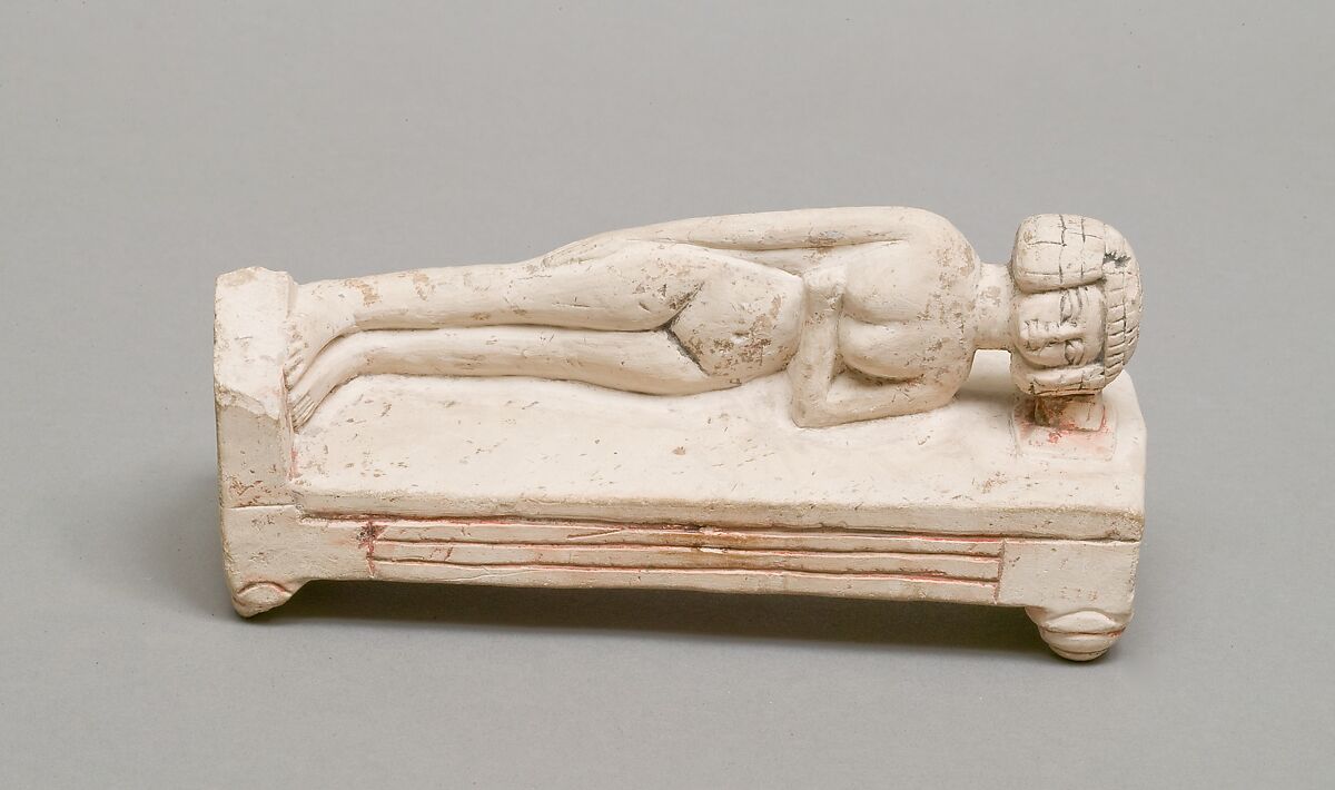 Reclining female figure on a bed, Limestone, paint 