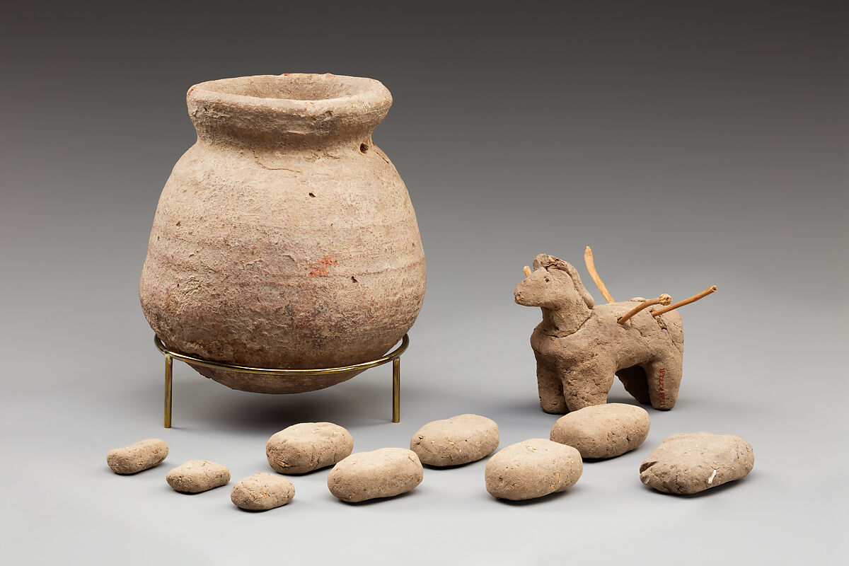 Donkey with packs on its back, Clay, twigs