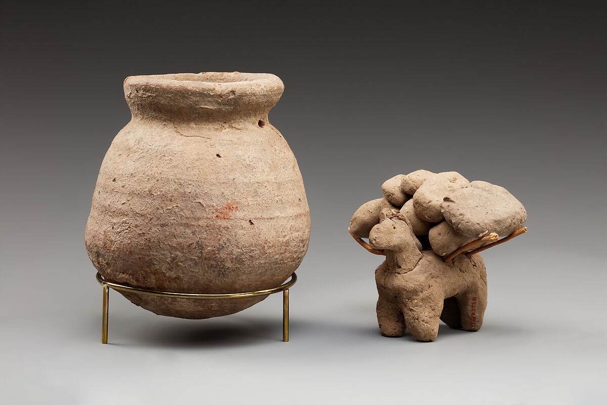 Donkey with packs on its back, Clay, twigs