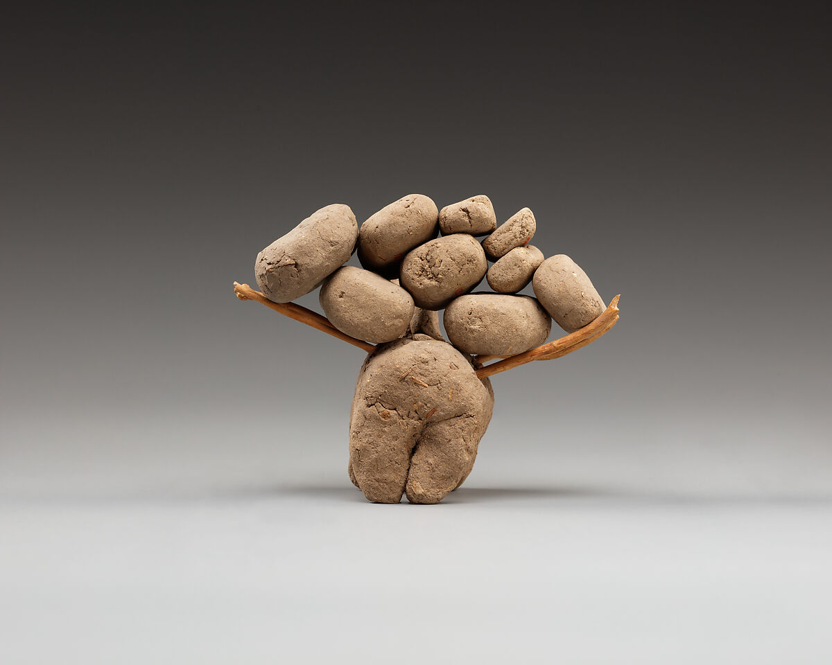 Donkey with packs on its back, Clay, twigs