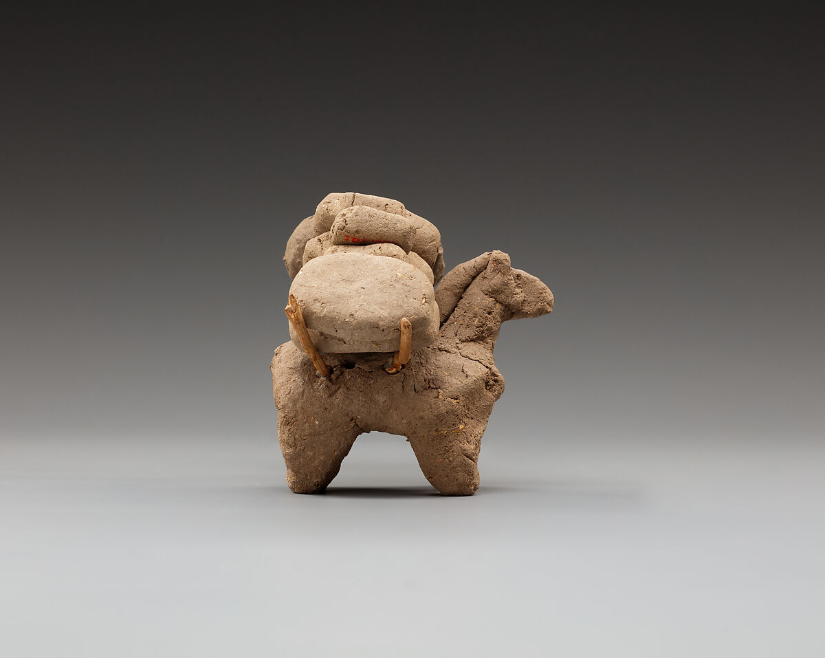 Donkey with packs on its back, Clay, twigs