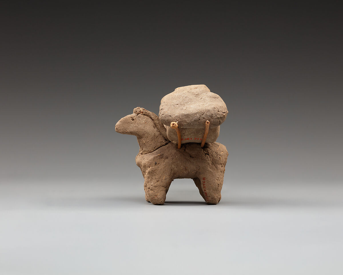 Donkey with packs on its back, Clay, twigs