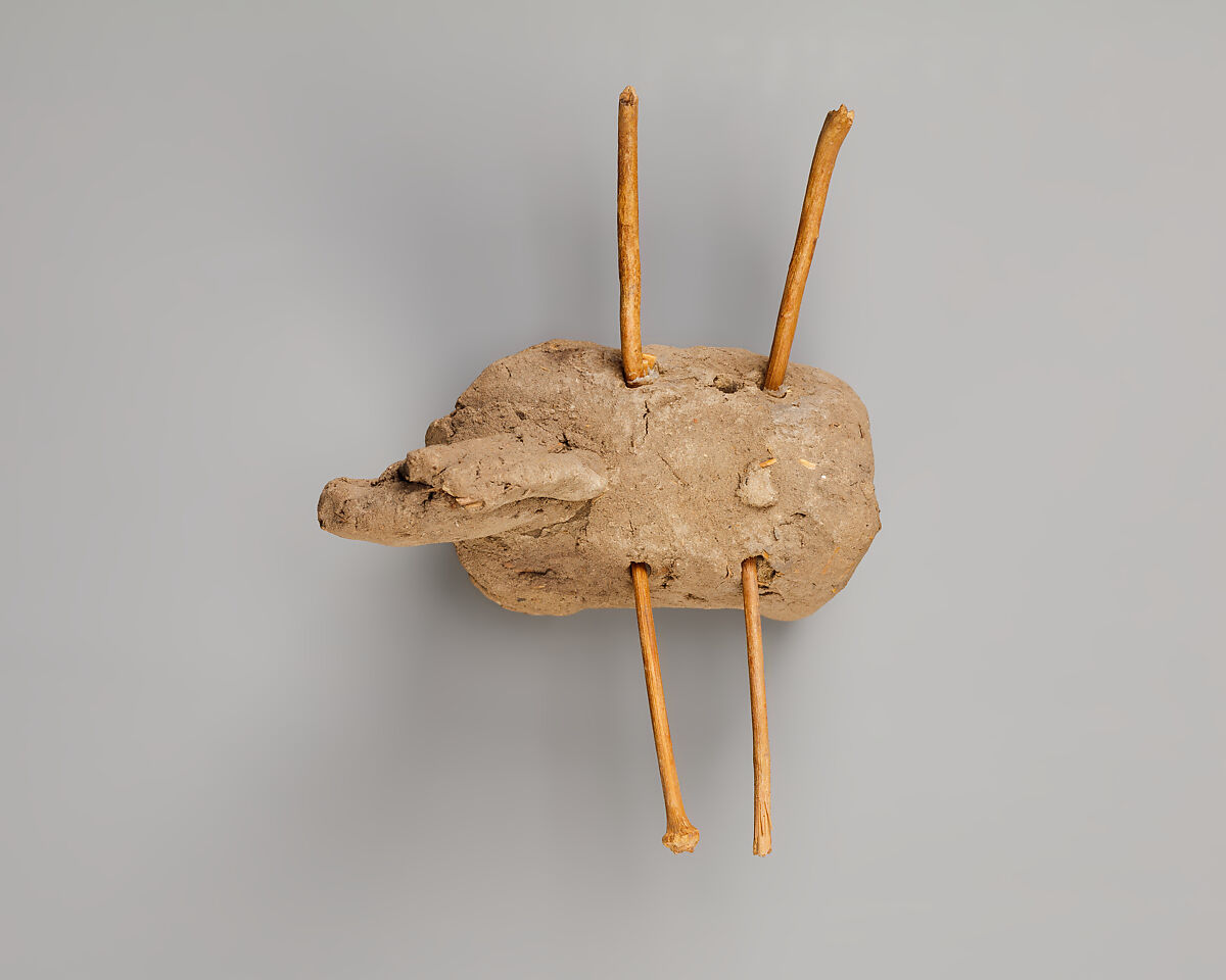 Donkey with packs on its back, Clay, twigs