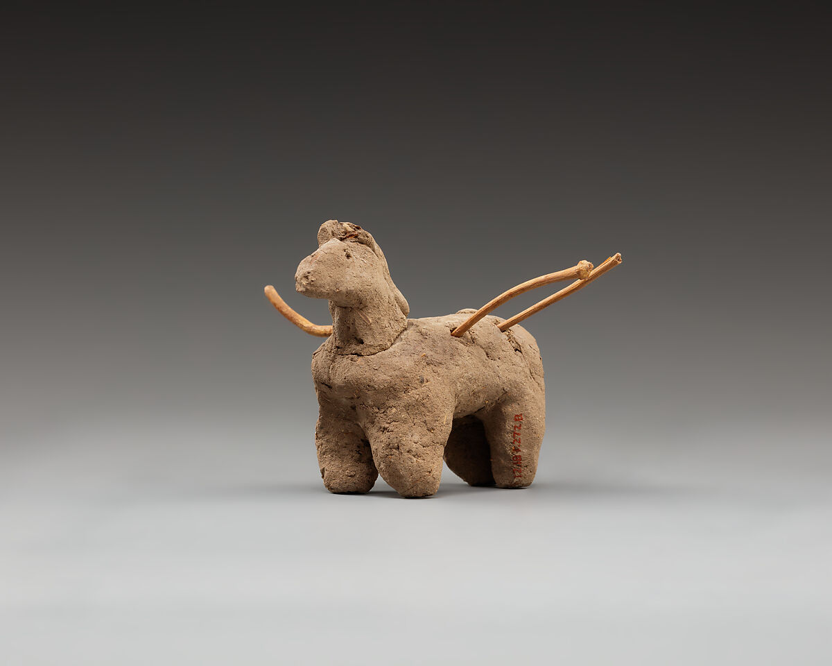 Donkey with packs on its back, Clay, twigs