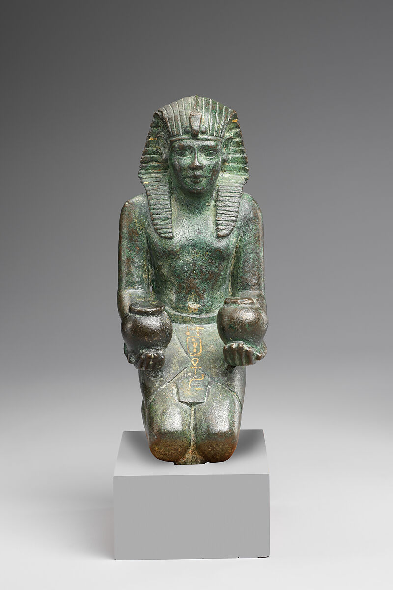 Kneeling statuette of King Amasis, Bronze, precious metal inlay and leaf