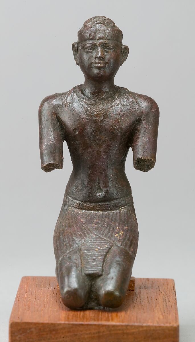 Statue of a kneeling Kushite king, Bronze; gold leaf