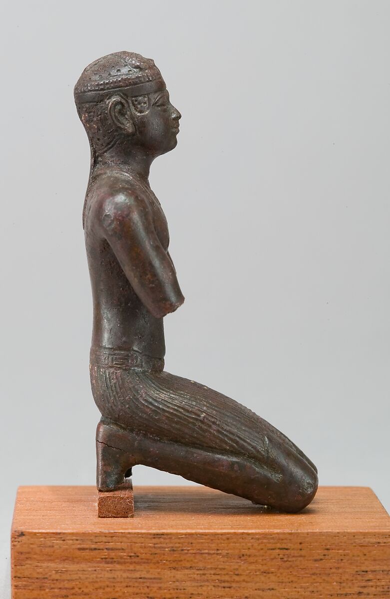 Statue of a kneeling Kushite king, Bronze; gold leaf