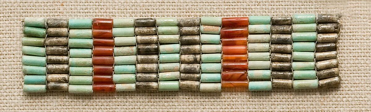 Bracelet from mummy of Satsebek, Blue and black faience, carnelian 