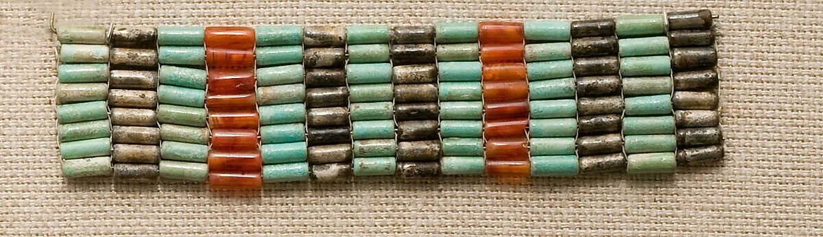 Bracelet from mummy of Satsebek, Blue and black faience, carnelian 