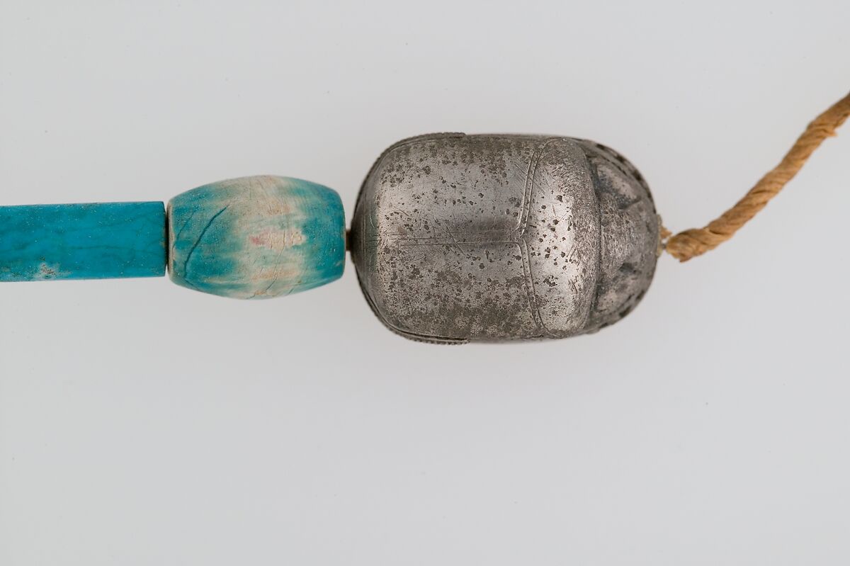 Scarab Bracelet of Wah, Silver, electrum, glazed steatite, linen cord 