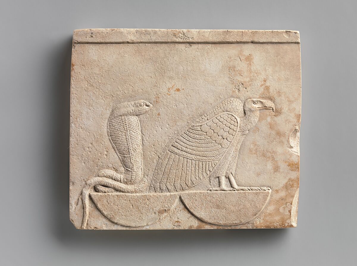 Relief  plaque with Vulture and Cobra on baskets; falcon on opposite, Limestone 