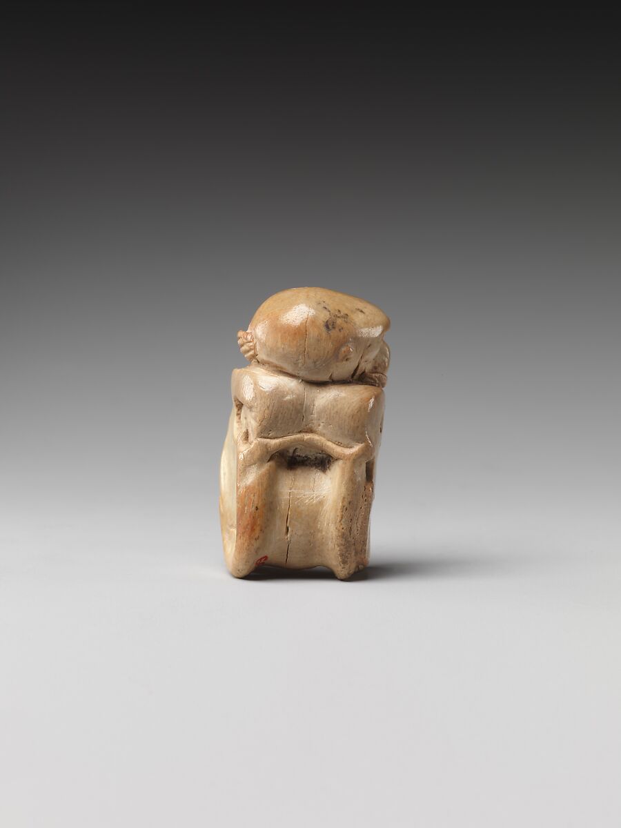 Game piece in the shape of a baboon, Bone