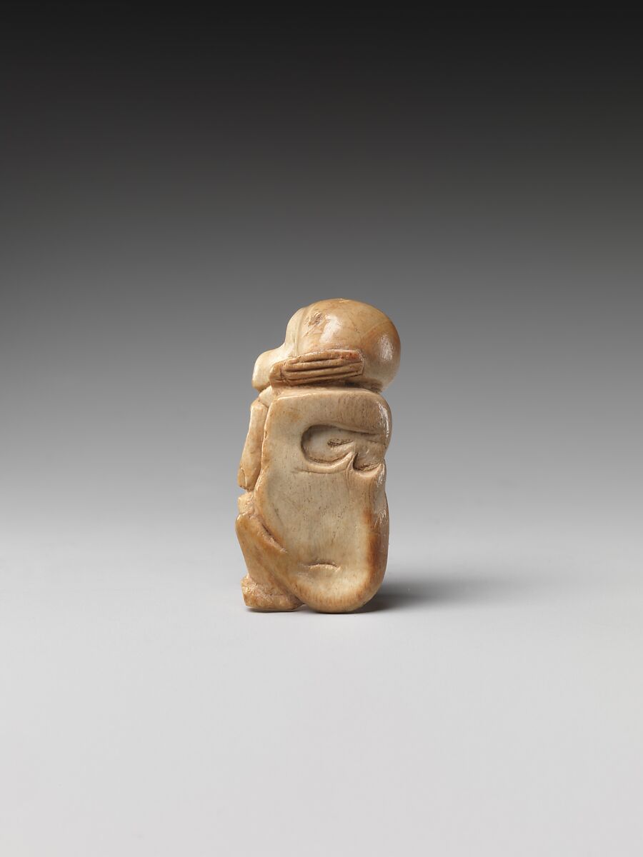 Game piece in the shape of a baboon, Bone