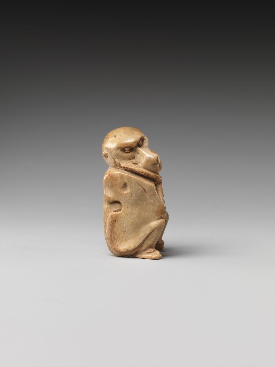Game piece in the shape of a baboon, Bone