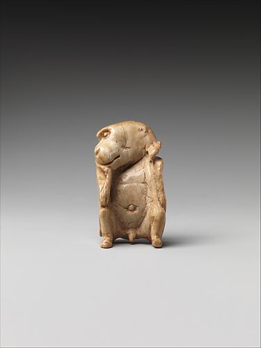 Game piece in the shape of a baboon