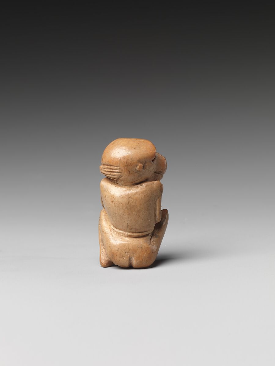 Game piece in the shape of a baboon, Bone