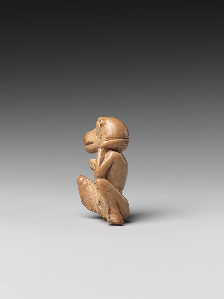 Game piece in the shape of a baboon, Bone