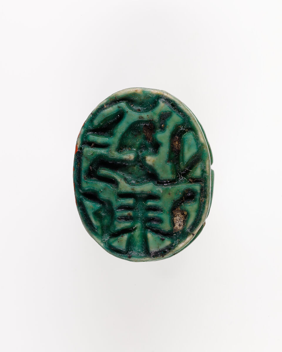 Human-face Scarab with Sphinx and Hieroglyphs, Dark green glazed steatite 