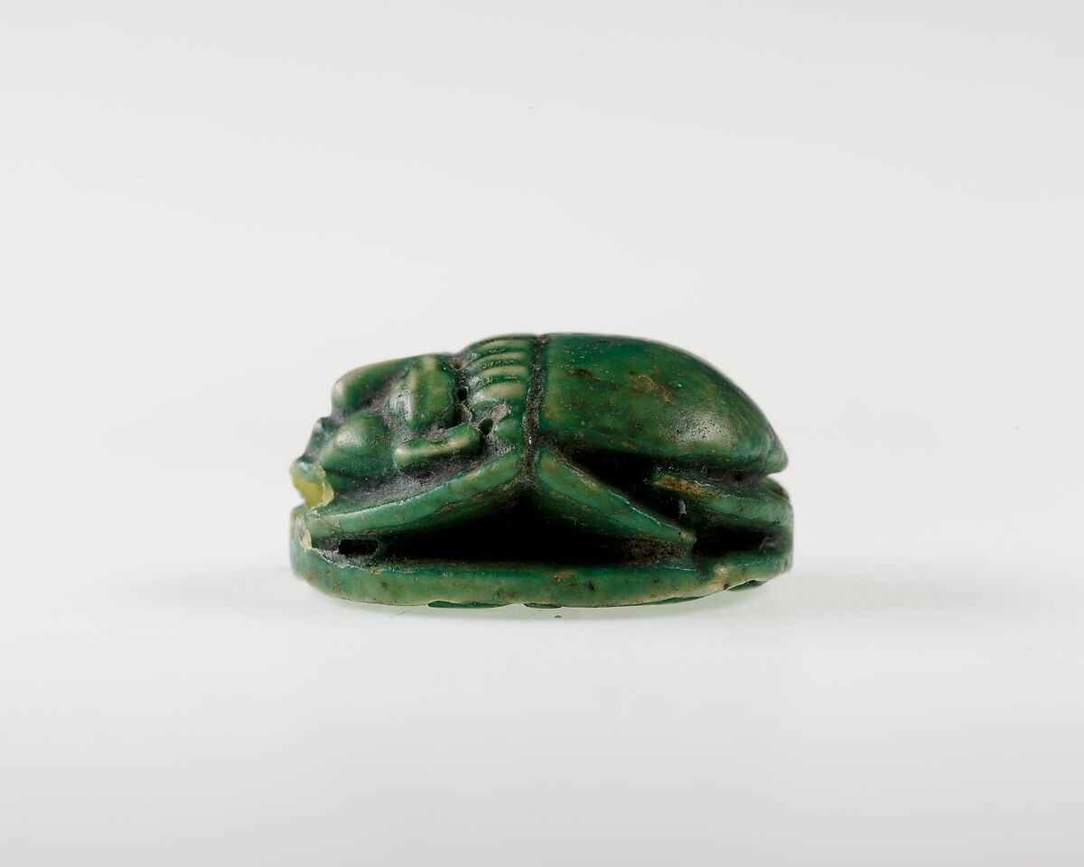 Human-face Scarab with Sphinx and Hieroglyphs, Dark green glazed steatite