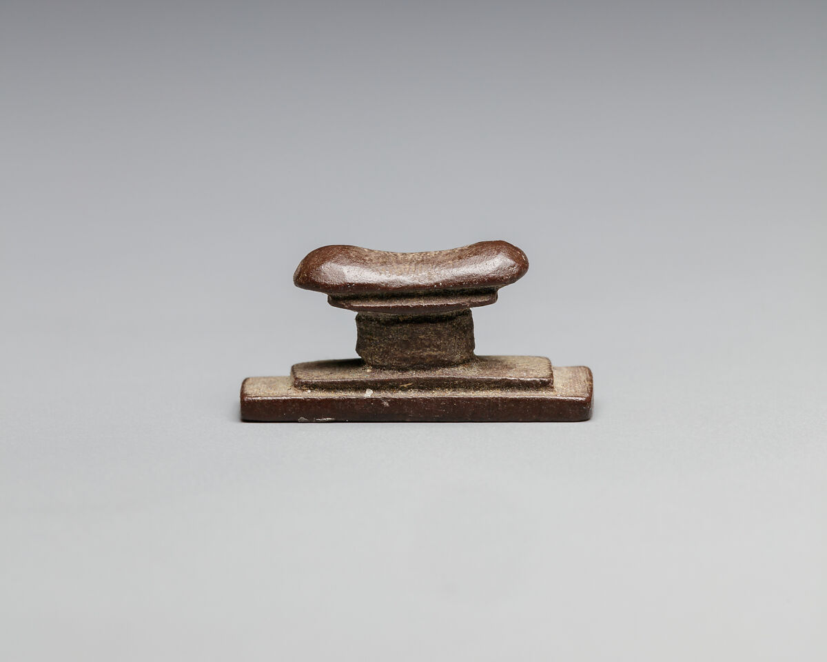 Headrest amulet, Stone
