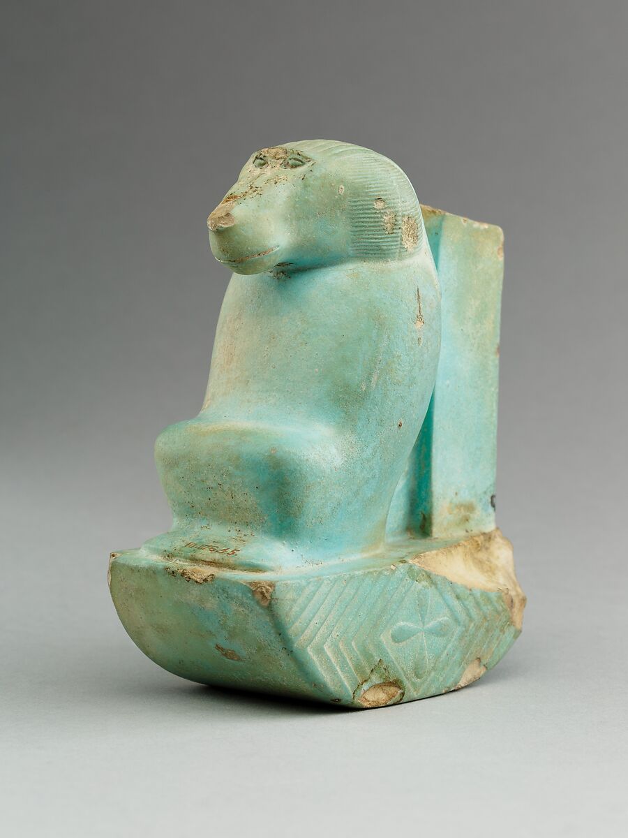 Figure of baboon on a basket and with a pillar (<em>shebet</em> offering), Faience, pale blue glaze