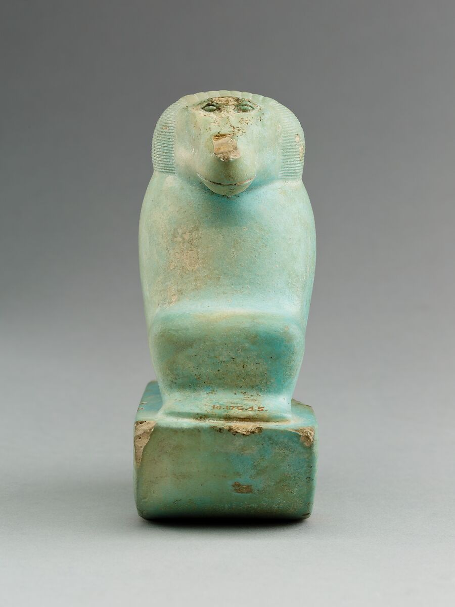 Figure of baboon on a basket and with a pillar (<em>shebet</em> offering), Faience, pale blue glaze