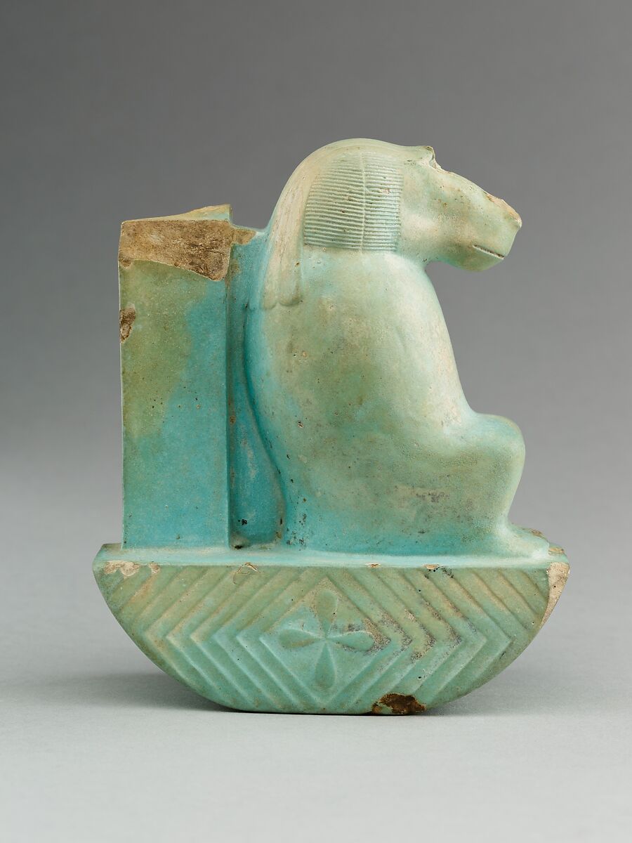 Figure of baboon on a basket and with a pillar (<em>shebet</em> offering), Faience, pale blue glaze