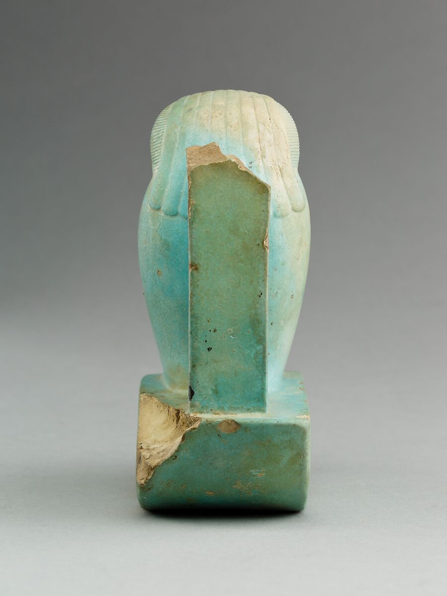 Figure of baboon on a basket and with a pillar (<em>shebet</em> offering), Faience, pale blue glaze