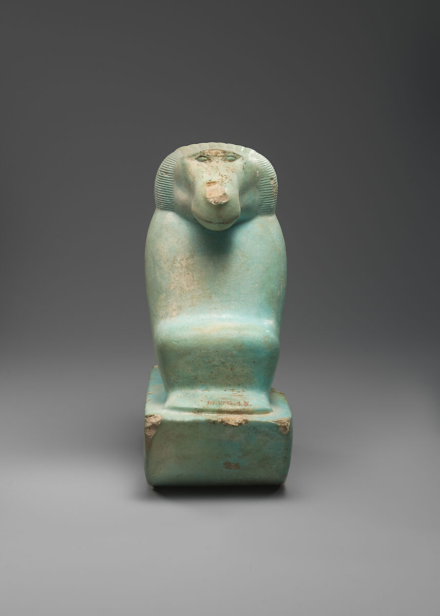 Figure of baboon on a basket and with a pillar (<em>shebet</em> offering), Faience, pale blue glaze