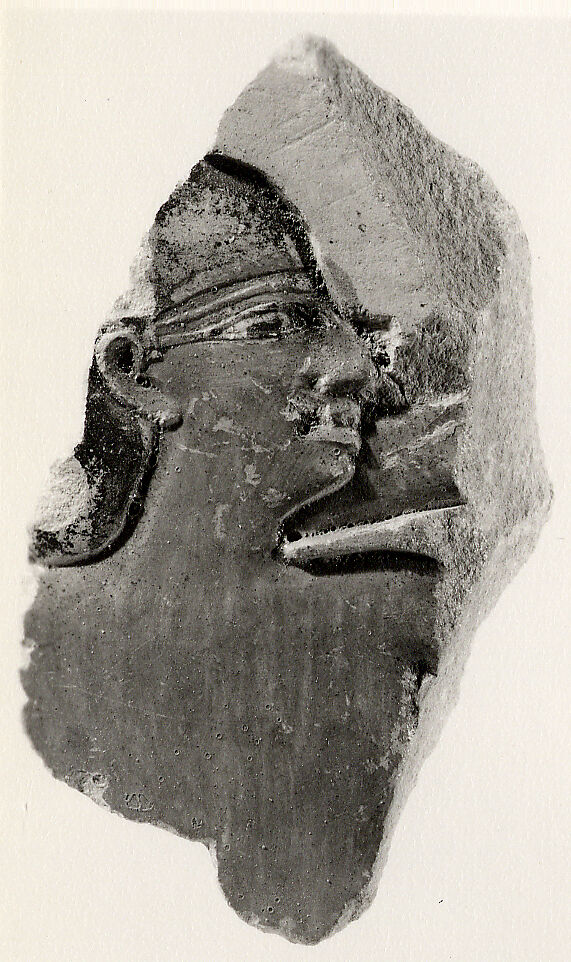 Part of a male figure, Limestone, paint 