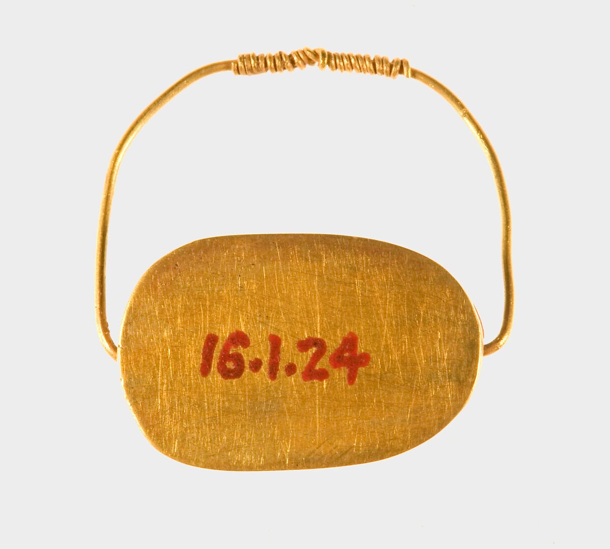 Scarab ring of Sithathoryunet, Gold, carnelian, lapis lazuli, and turquoise, bedding material