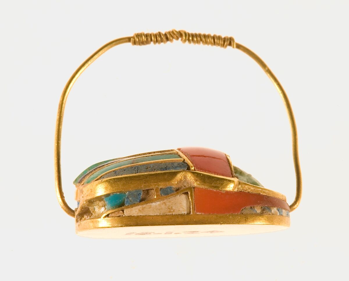 Scarab ring of Sithathoryunet, Gold, carnelian, lapis lazuli, and turquoise, bedding material