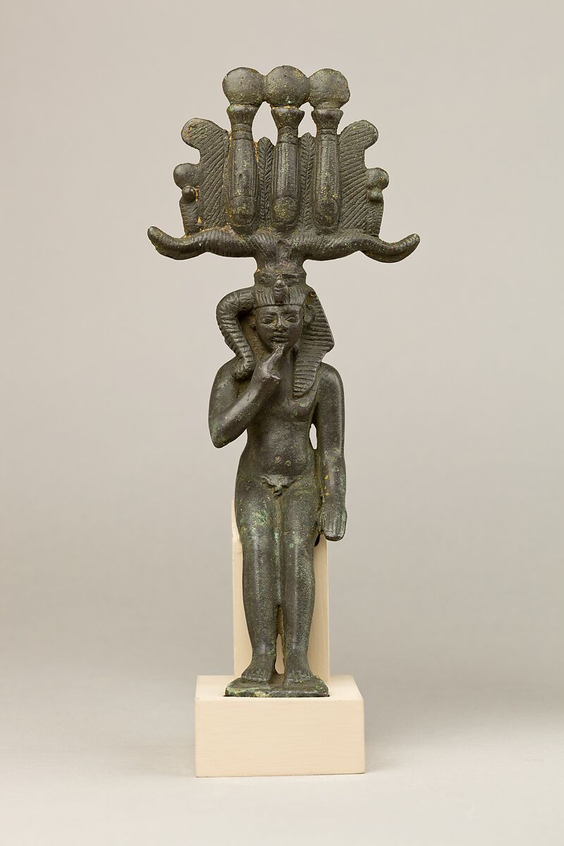 Child god in nemes and hemhem crown, Cupreous metal 