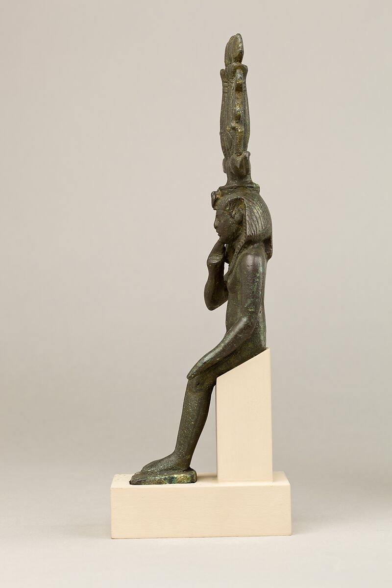 Child god in <em>nemes</em> and <em>hemhem</em> crown, Cupreous metal