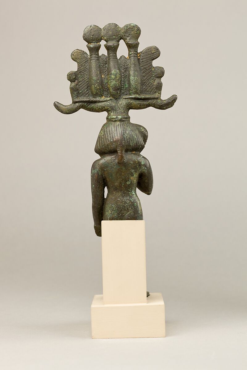 Child god in <em>nemes</em> and <em>hemhem</em> crown, Cupreous metal