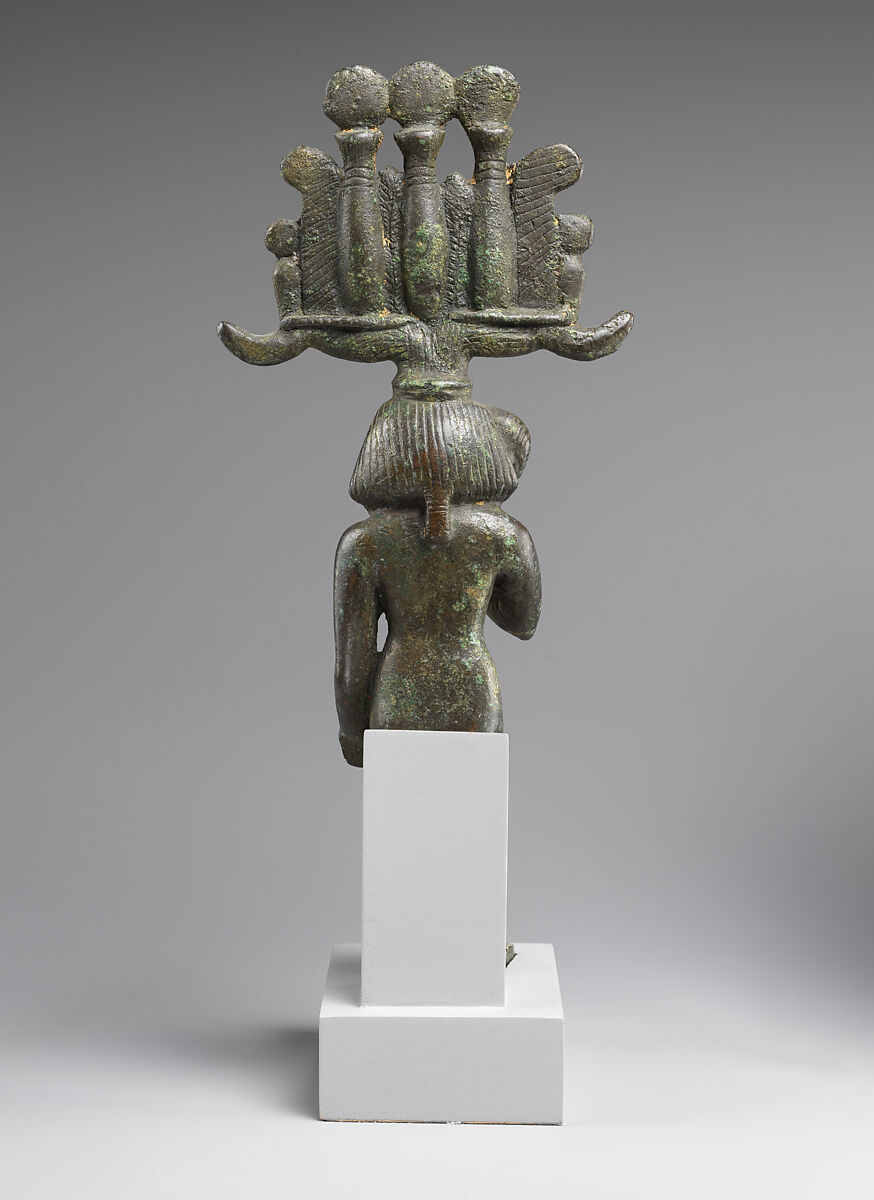 Child god in <em>nemes</em> and <em>hemhem</em> crown, Cupreous metal