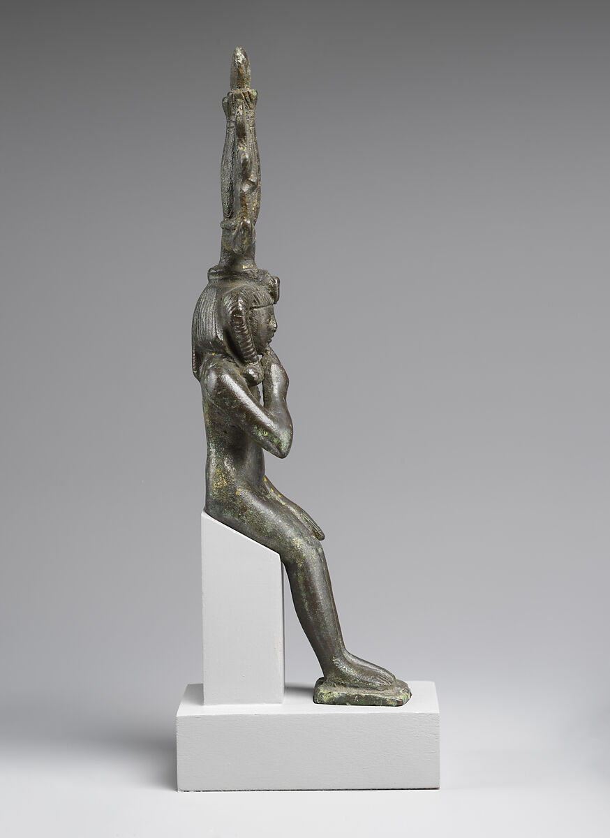 Child god in <em>nemes</em> and <em>hemhem</em> crown, Cupreous metal