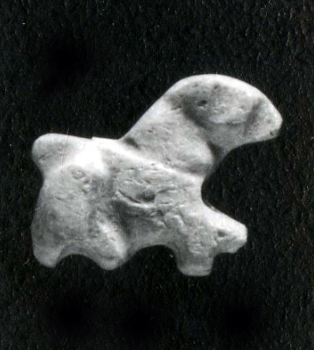 Dog (?) amulet, Ivory 