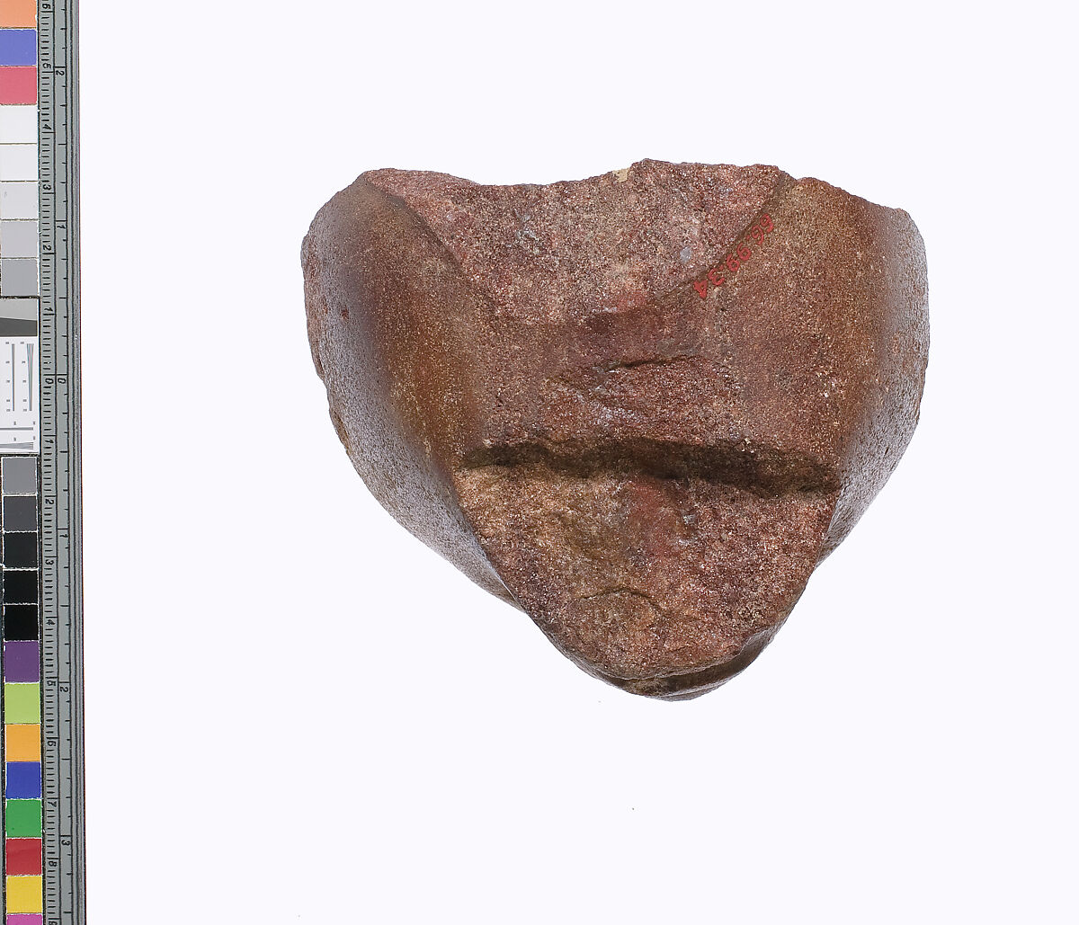 Lower part of a royal head, Red quartzite