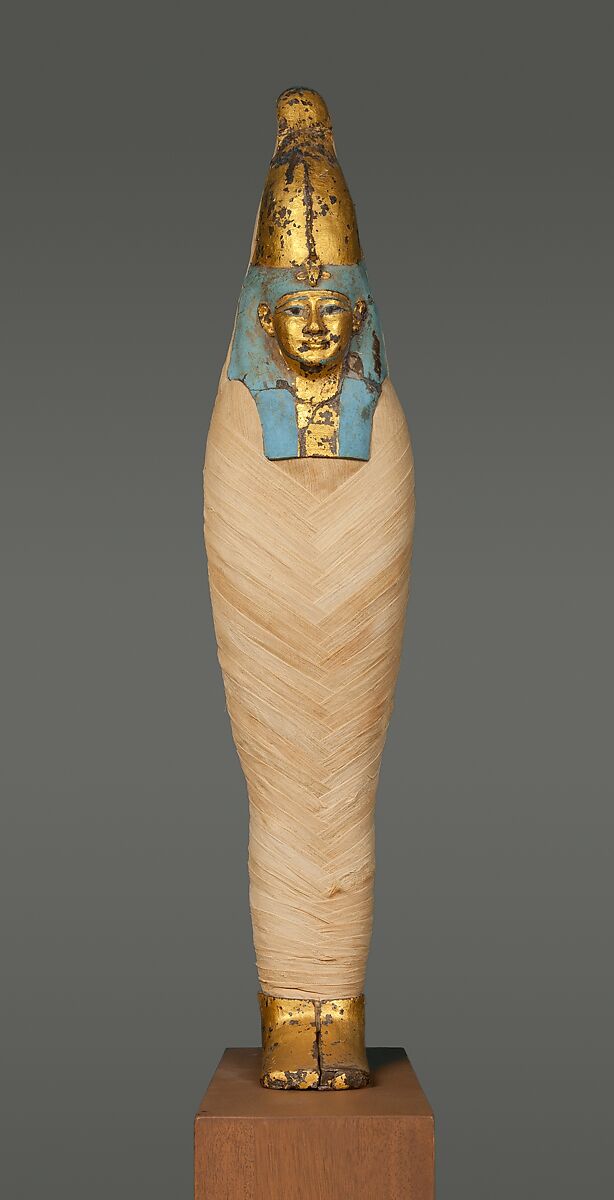 Mask and Foot Cover of  "Corn Mummy", Gilded wax on a reconstructed body of ancient linen 