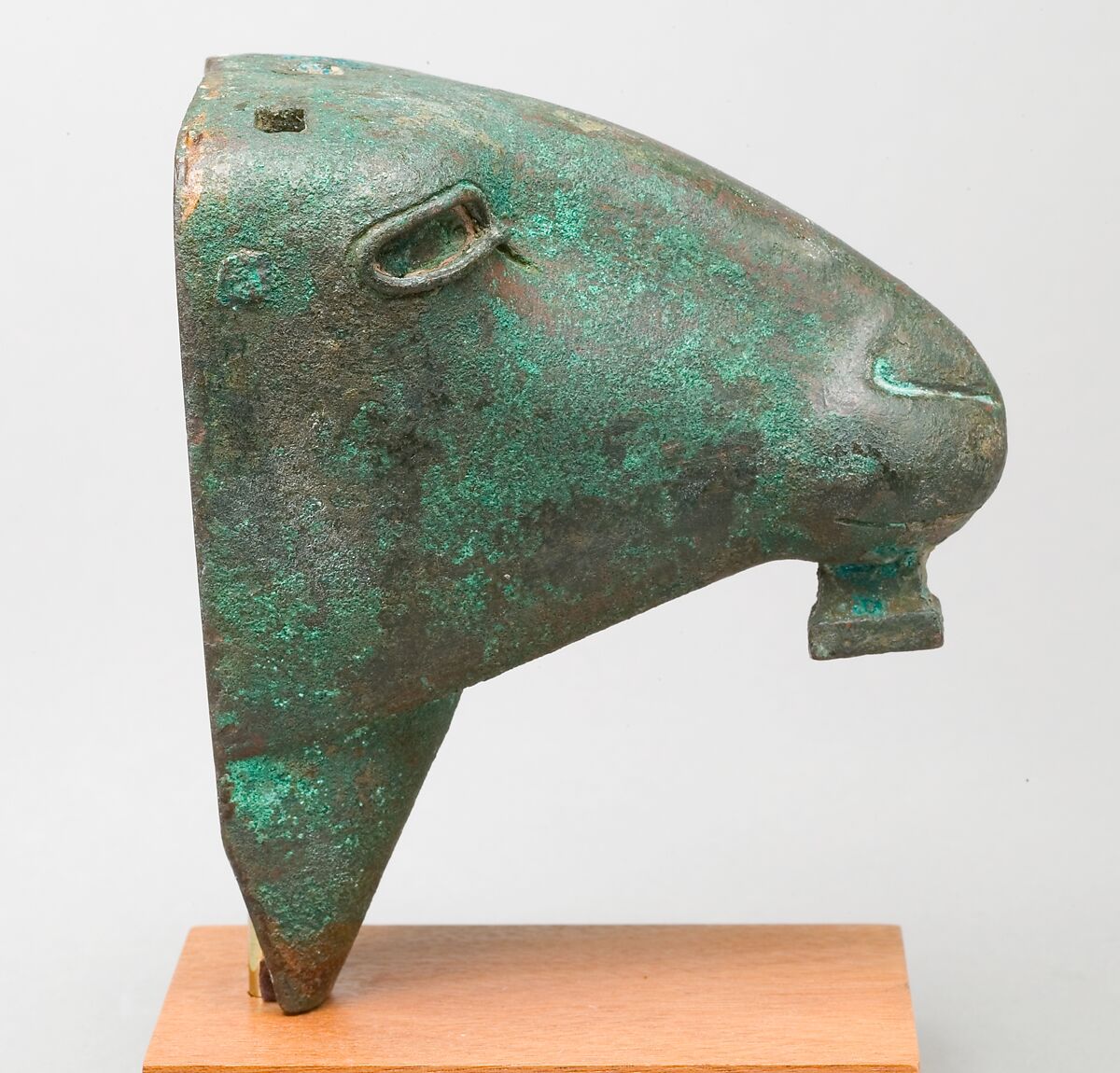 Ram head made for attachment to a barque, Leaded bronze, precious metal leaf, copper alloy inlay in eye rims