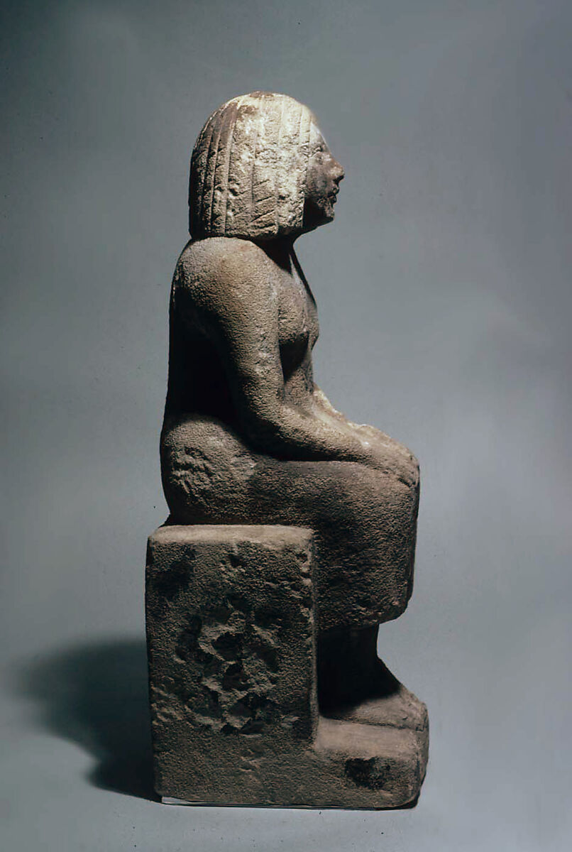 Seated woman, Sandy fossiliferous limestone