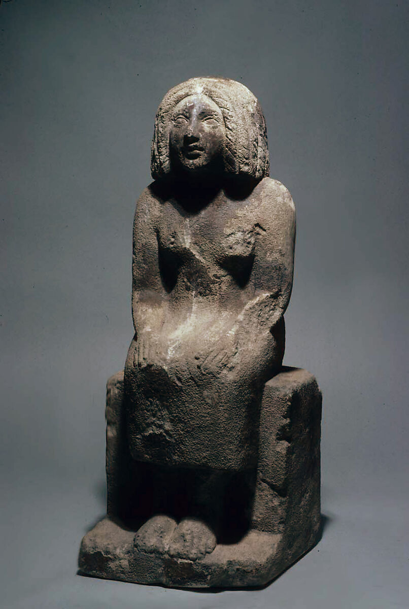 Seated woman, Sandy fossiliferous limestone