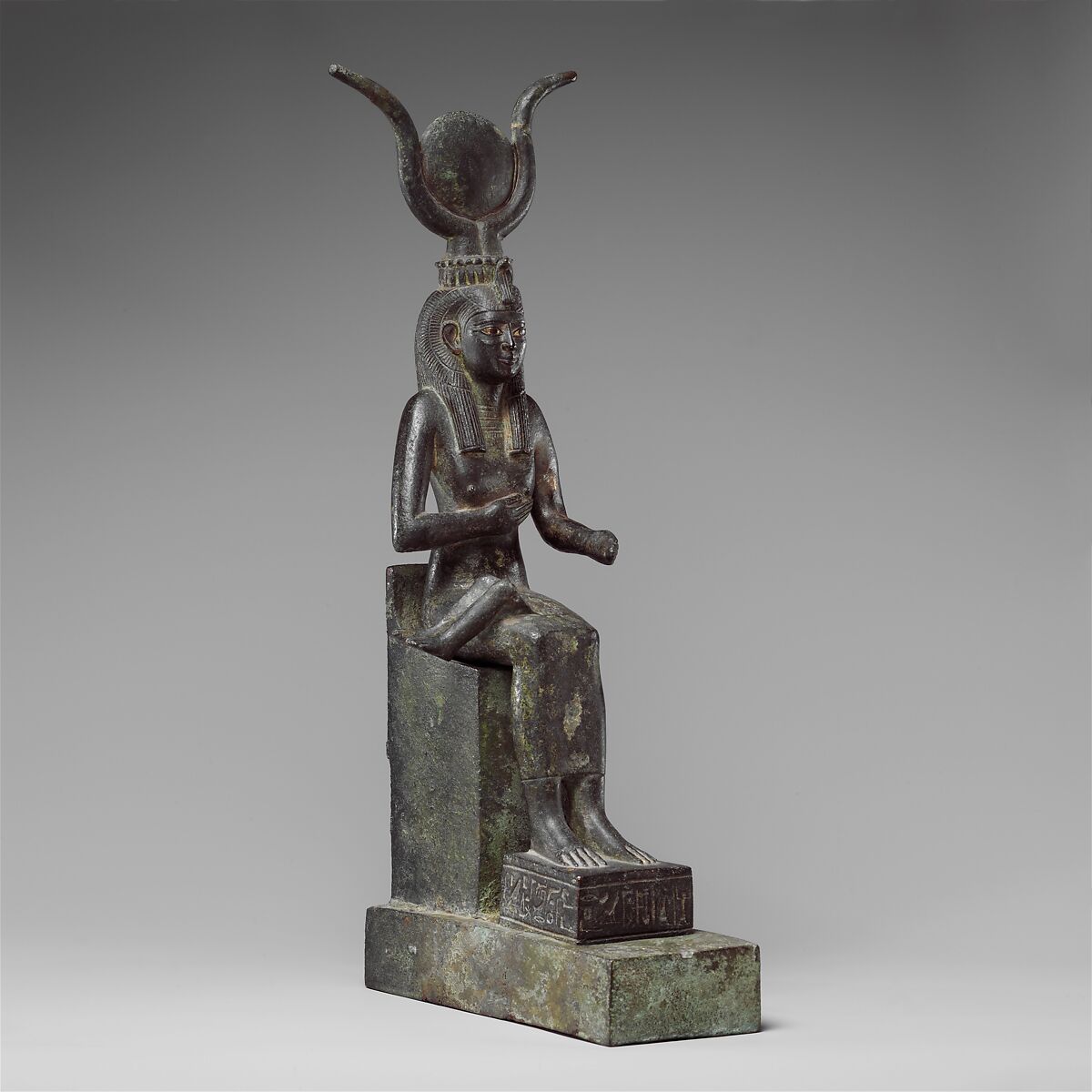 Statuette of Isis nursing Horus (missing above the legs), inscribed for Hor son of Padihorresnet, Bronze, gilded silver, electrum; separate leaded bronze throne