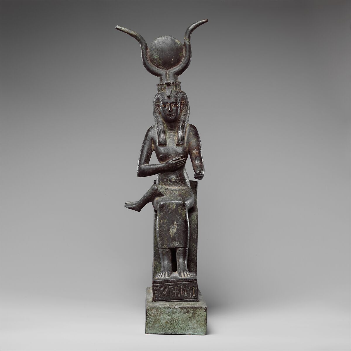 Statuette of Isis nursing Horus (missing above the legs), inscribed for Hor son of Padihorresnet, Bronze, gilded silver, electrum; separate leaded bronze throne 