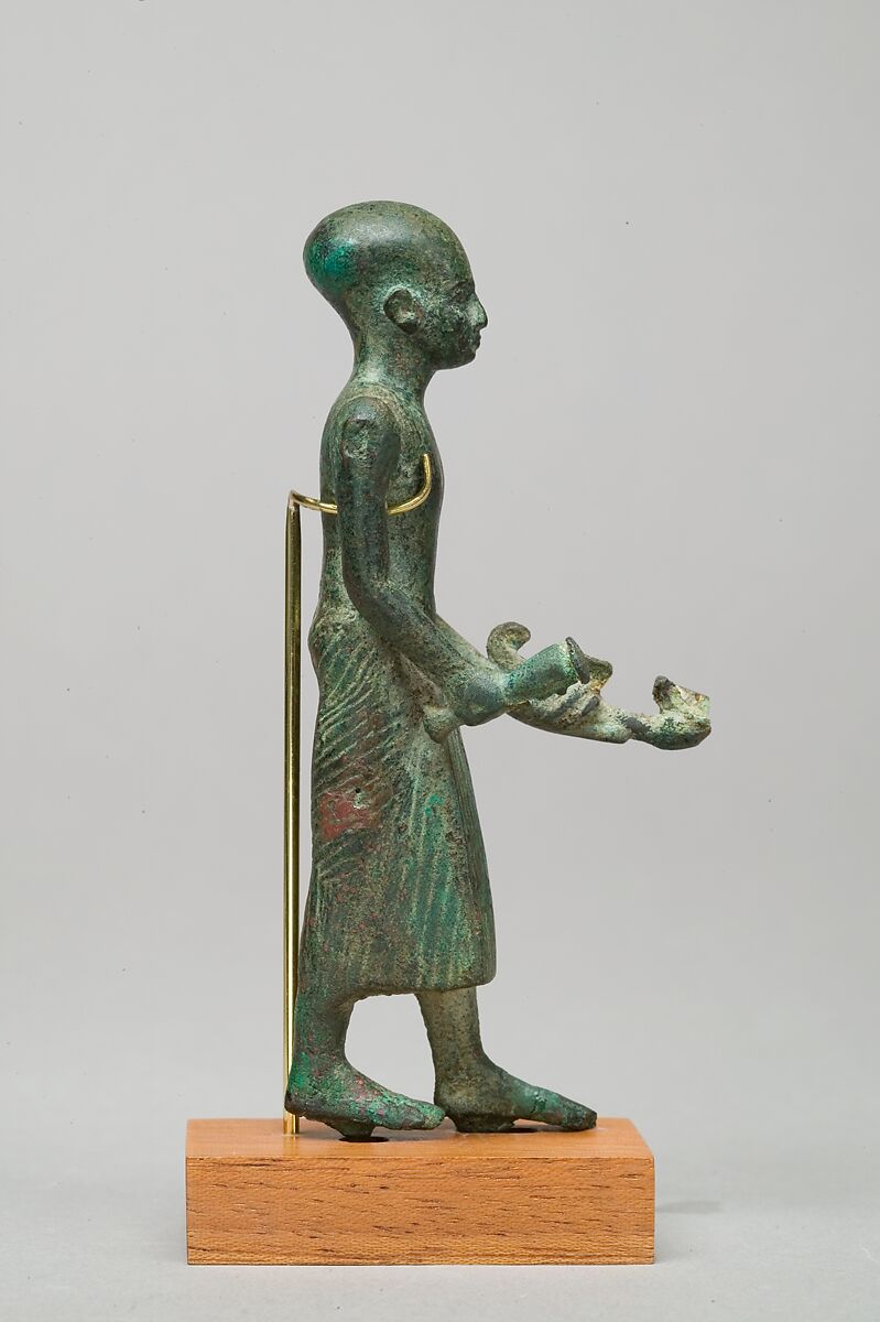 Priest with vase and censer, Leaded bronze, gold leaf on censer and vessel