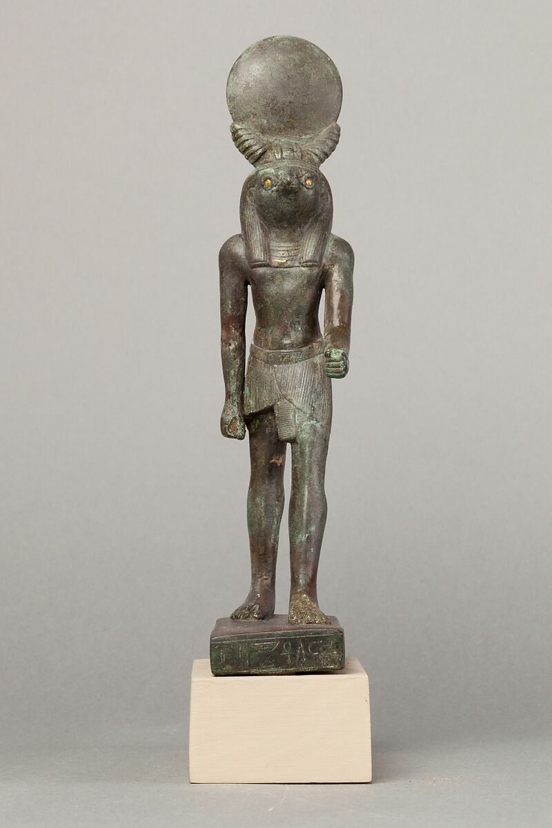 An ancient base asking blessings from Heka for the Scribe of the Library of Atum Pa-kap, son of the Prophet of Atum Pa-iry-kap and the mistress of the House Hr-ib-Wadjet; statue modern above the ankles, Bronze, precious metal inlay 