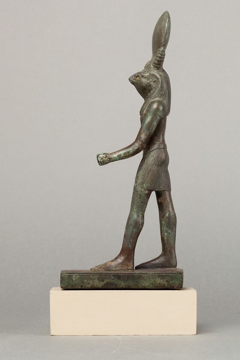 An ancient base asking blessings from Heka for the Scribe of the Library of Atum Pa-kap, son of the Prophet of Atum Pa-iry-kap and the mistress of the House Hr-ib-Wadjet; statue modern above the ankles, Bronze, brass, precious metal inlay